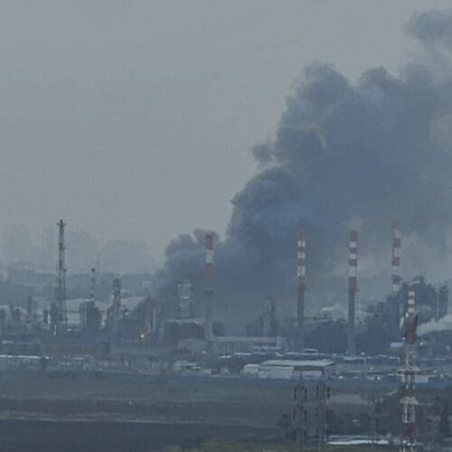 Missile interception fragments of an Iranian missile hit Haifa oil refineries in Haifa Bay, March, 19 2026. The strike caused temporary power outages after hitting a high-voltage line. Smoke was visible in the area. Photographed from the city of Nesher.