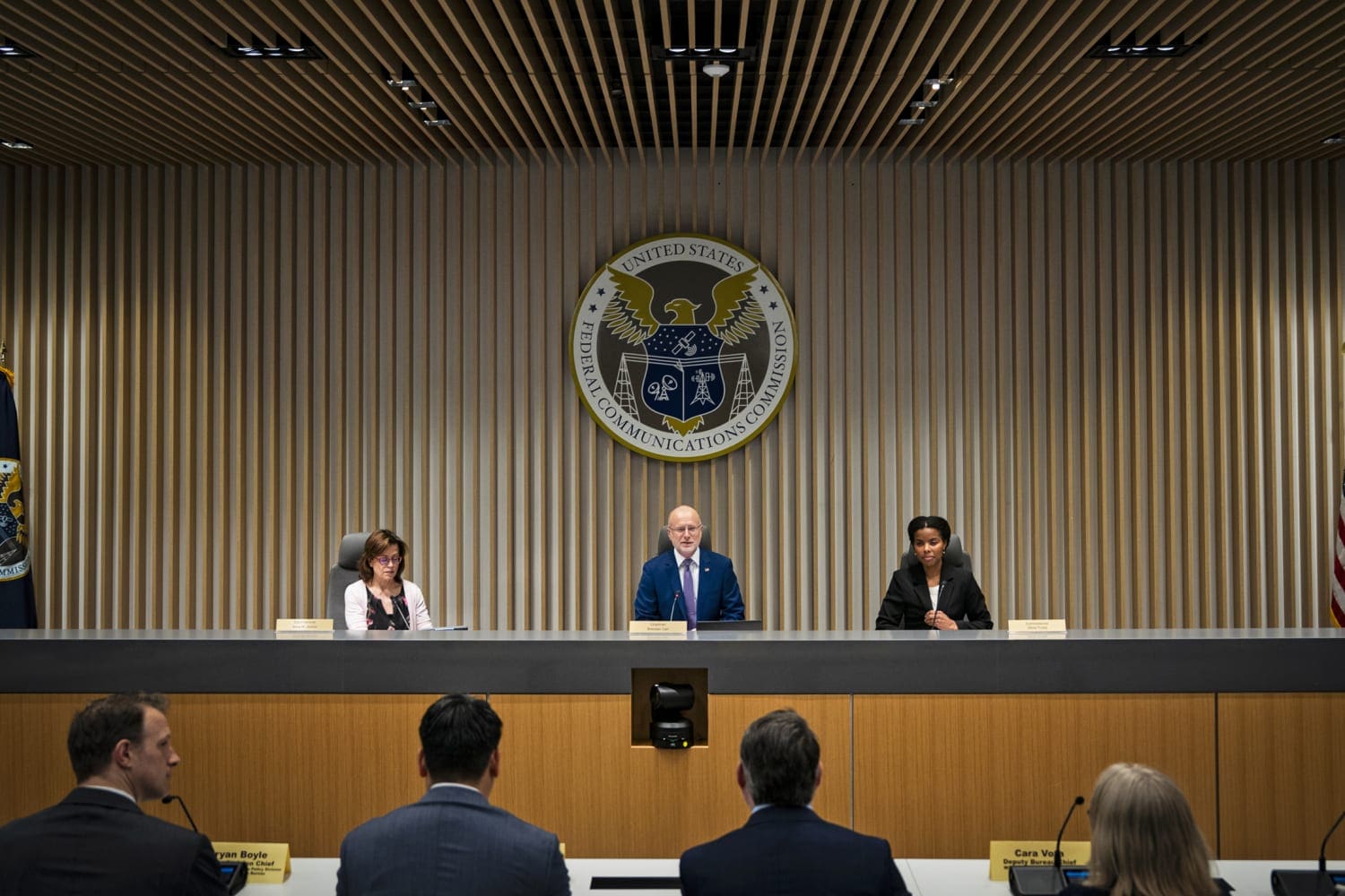 Weather 8 Fcc chairman brendan carr, center, during an open commission meeting at the fcc headquarters in february. Photo via al drago (getty images).