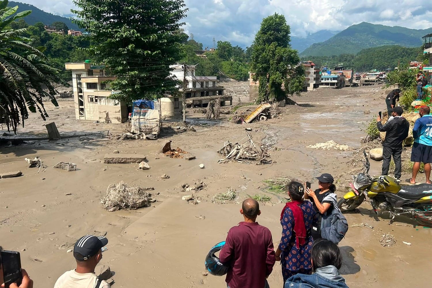 U.S. allies doubt Strait of Hormuz is fully cleared of mines 5 Residents look at houses partially submerged in muddy water after flash floods at trishuli bazar in nepal's nuwakot district on wednesday.