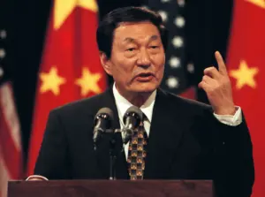 Former chinese premier zhu rongji speaking in 1999 (britannica).