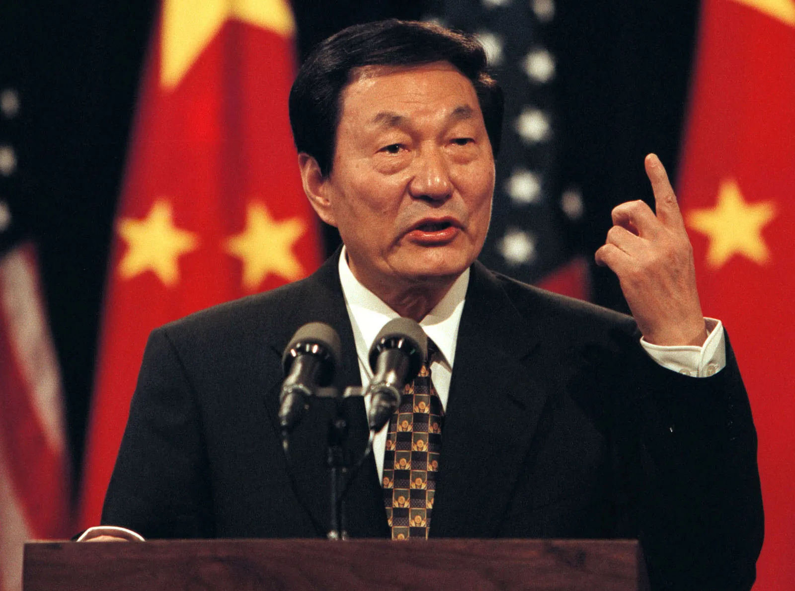 Former Chinese Premier Zhu Rongji speaking in 1999 (Britannica).